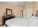 Neutral bedroom featuring natural light and dark furniture at 2864 Polana St # 104, Orlando, FL 32835