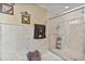 Beautiful bathroom with tiled walls and frameless glass shower enclosure at 2864 Polana St # 104, Orlando, FL 32835