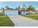 Charming single-story home with a two-car garage and long driveway at 3176 Sw 127Th St, Ocala, FL 34473
