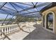 Expansive balcony with a decorative balustrade and wrought iron roof overlooking the trees at 3402 Cocard Ct, Windermere, FL 34786