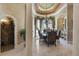 Formal dining room featuring a decorative ceiling, chandelier, and large windows at 3402 Cocard Ct, Windermere, FL 34786