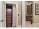 Home elevator with wood paneling and adjacent cabinets at 3402 Cocard Ct, Windermere, FL 34786