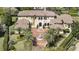 Beautifully landscaped Mediterranean-style home with a circular driveway and fountain at 3402 Cocard Ct, Windermere, FL 34786