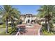 Stunning Mediterranean-style home featuring a fountain, lush landscaping, and a circular driveway at 3402 Cocard Ct, Windermere, FL 34786