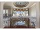 Ornate foyer and staircase with chandelier at 3402 Cocard Ct, Windermere, FL 34786