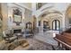 Ornate living room featuring a fireplace, high ceilings, and elegant furnishings perfect for luxurious living at 3402 Cocard Ct, Windermere, FL 34786