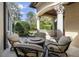 Charming outdoor patio featuring stone flooring, an elegant seating area, and verdant garden views at 3402 Cocard Ct, Windermere, FL 34786