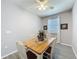 Charming dining area with a wood table, four chairs, and a ceiling fan at 434 Alcove Dr, Groveland, FL 34736