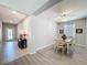 Bright dining room with wainscoting, a ceiling fan, and lots of natural light at 434 Alcove Dr, Groveland, FL 34736