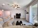 Spacious living room featuring wood floors, a ceiling fan, and a sliding glass door at 434 Alcove Dr, Groveland, FL 34736