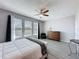 Comfortable main bedroom featuring a ceiling fan, and modern furniture at 434 Alcove Dr, Groveland, FL 34736