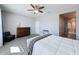 Cozy main bedroom with plank floors, a ceiling fan, and modern furniture at 434 Alcove Dr, Groveland, FL 34736