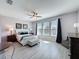 Bright main bedroom with plank floors, a ceiling fan, and lots of natural light at 434 Alcove Dr, Groveland, FL 34736