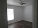 A bright bedroom with wood-look floors at 445 Live Oak Ave, Chuluota, FL 32766