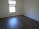 Bedroom featuring a window and vinyl flooring at 445 Live Oak Ave, Chuluota, FL 32766