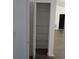 Hallway closet with shelving at 445 Live Oak Ave, Chuluota, FL 32766