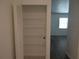 Hall closet with built-in shelving at 445 Live Oak Ave, Chuluota, FL 32766