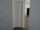 Hallway closet with an open door at 445 Live Oak Ave, Chuluota, FL 32766