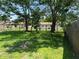 A large backyard with grass and a view of the fence line at 4845 Elese St, Orlando, FL 32811