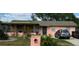 Charming single-story home with a cozy front porch, neat landscaping, and off-street parking at 4845 Elese St, Orlando, FL 32811