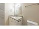 Bathroom featuring a modern vanity with granite countertop, a sink, and a tiled shower at 4906 Cortez Dr, Orlando, FL 32808