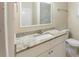 Bright bathroom featuring a white vanity with granite countertop, a sink, and a modern faucet at 4906 Cortez Dr, Orlando, FL 32808