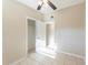 Neutral bedroom featuring tile flooring, closet, and ceiling fan at 4906 Cortez Dr, Orlando, FL 32808