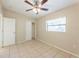 Bedroom featuring tile flooring, closet, ceiling fan, and natural light at 4906 Cortez Dr, Orlando, FL 32808