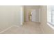 This spacious bedroom features tile flooring, baseboards, and bright natural light at 4906 Cortez Dr, Orlando, FL 32808