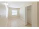 The bright bedroom features tile flooring, baseboards, closet and windows at 4906 Cortez Dr, Orlando, FL 32808