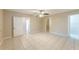 Spacious bedroom with tile flooring, open doorway, and a ceiling fan at 4906 Cortez Dr, Orlando, FL 32808