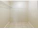 A walk-in closet with tile flooring and shelving at 4906 Cortez Dr, Orlando, FL 32808