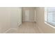 The hallway features tile flooring, baseboards, and bright natural light at 4906 Cortez Dr, Orlando, FL 32808