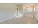 Open living room featuring tile floors, neutral walls, and a welcoming entrance area at 4906 Cortez Dr, Orlando, FL 32808