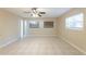 Living room featuring tile flooring and multiple windows at 4906 Cortez Dr, Orlando, FL 32808