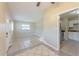Inviting living area showcases tile flooring, neutral walls, and a doorway leading to the kitchen at 4906 Cortez Dr, Orlando, FL 32808