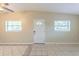 Bright living room featuring tile floors, neutral walls, and natural light from large windows at 4906 Cortez Dr, Orlando, FL 32808