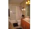 Bathroom featuring a shower-tub combo with tile surround, vanity with sink, and neutral color scheme at 506 Freeman St, Longwood, FL 32750