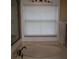 Bathroom with a bathtub featuring tile surround and large window at 506 Freeman St, Longwood, FL 32750