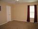 Spacious bedroom featuring carpet flooring, a ceiling fan, and window allowing for ample natural light at 506 Freeman St, Longwood, FL 32750