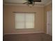 Bedroom with a large window and a ceiling fan at 506 Freeman St, Longwood, FL 32750