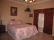 Bedroom featuring a patterned bedspread, window with curtain, and neutral walls at 506 Freeman St, Longwood, FL 32750