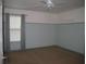 Neutral bedroom featuring two tone walls, carpet flooring, window, and closet at 506 Freeman St, Longwood, FL 32750