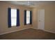 A simple bedroom with carpeted flooring and bright windows at 506 Freeman St, Longwood, FL 32750