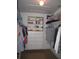 Walk-in closet with built-in shelving and hanging rods for optimal organization at 506 Freeman St, Longwood, FL 32750