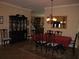 Formal dining room with a large dining table, dark wood china cabinet, and traditional decor at 506 Freeman St, Longwood, FL 32750