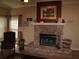 Cozy fireplace with brick surround, decorative mantel and painting at 506 Freeman St, Longwood, FL 32750