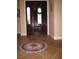 A tiled foyer with a decorative mosaic tile floor at the front entrance at 506 Freeman St, Longwood, FL 32750