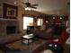 Open concept living area with a fireplace, sofa, and view of the kitchen at 506 Freeman St, Longwood, FL 32750