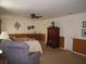 Large main bedroom with neutral walls, carpeting, a ceiling fan, and multiple doors at 506 Freeman St, Longwood, FL 32750